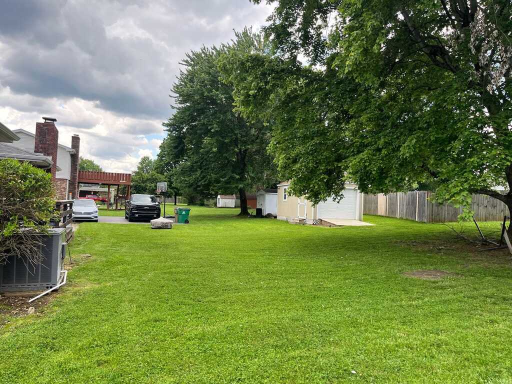 Residential lawn with mowing lines and trimmed yard edge